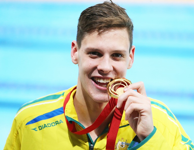 Gold medallist Mitch Larkin of Australia poses after the medal ceremony for the Men's 200m Backstroke Final