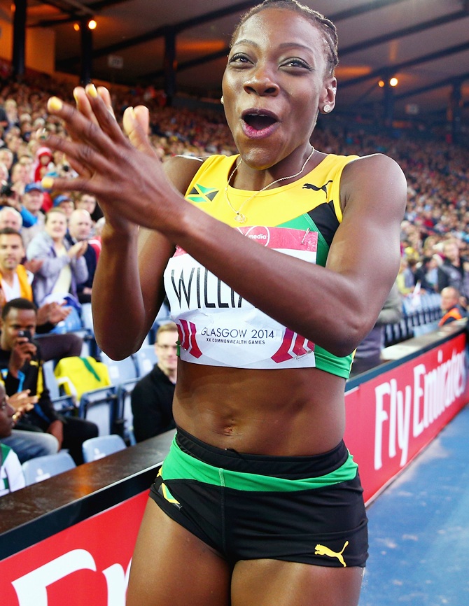 Kimberly Williams of Jamaica celebrates winning gold in the women's Triple Jump final