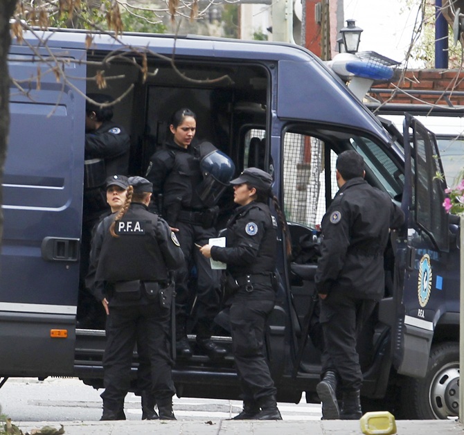 Police stand near the home of Juan Alberto Cabral, father of Juventus' Carlos Tevez, in Buenos Aires