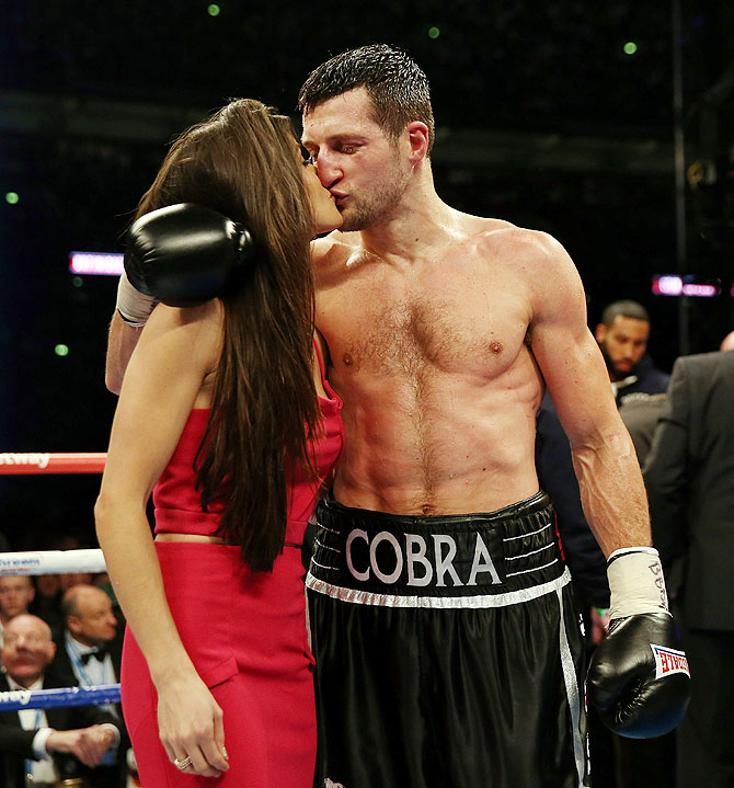 Carl Froch celebrates with his girlfriend after his victory over Geroge Groves during their IBF and WBA World Super Middleweight bout at Wembley Stadium in London on Saturday