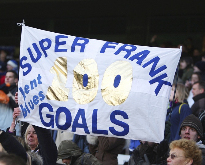 Fans celebrate Frank Lampard's 100th goal during the FA Cup 5th Round match against Huddersfield Town at Stamford Bridge on February 16, 2008 in London