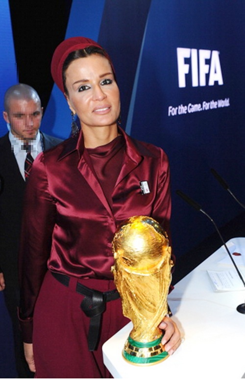 Sheika Moza bint Nasser poses with the World Cup trophy after Qatar were awarded the 2022 FIFA World Cup