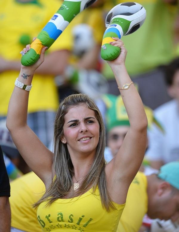 A Brazil fan enjoys the pre-match atmosphere