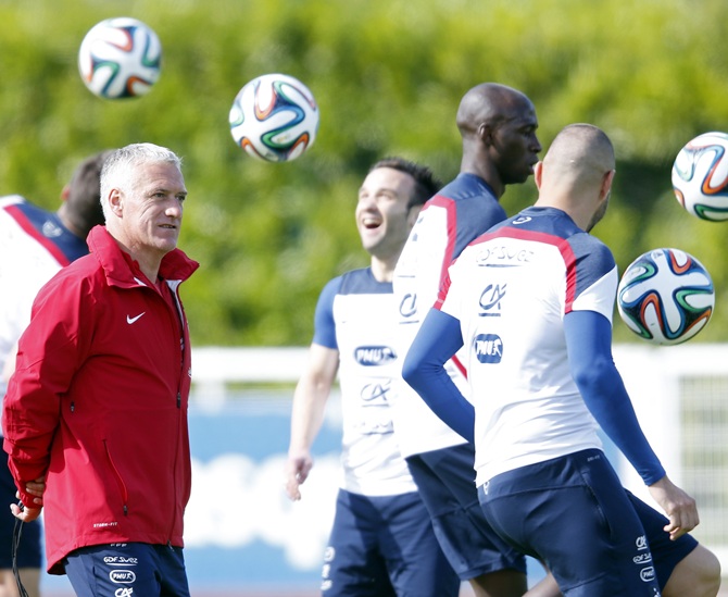 France's national soccer team coach Didier Deschamps,left, conducts a training session