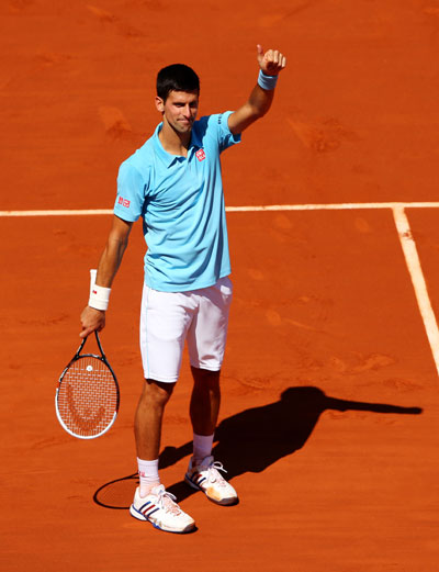Novak Djokovic of Serbia celebrates victory in his men's singles semi-final against Ernests Gulbis of Latvia