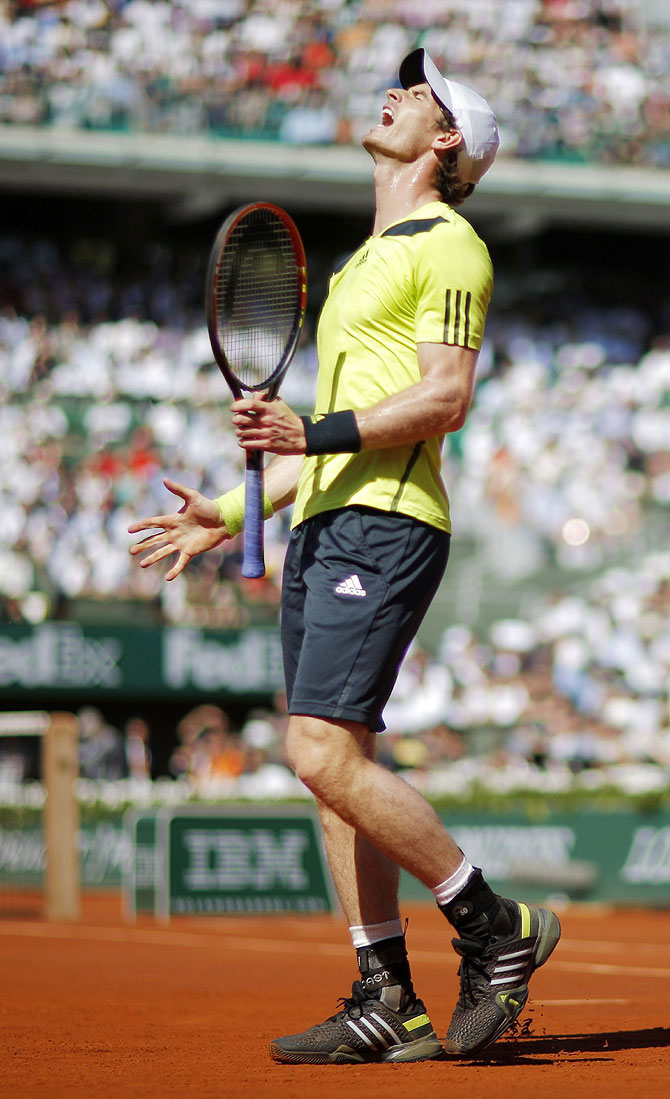 Andy Murray of Britain reacts during his men's semi-final match against Rafael Nadal of Spain on Friday