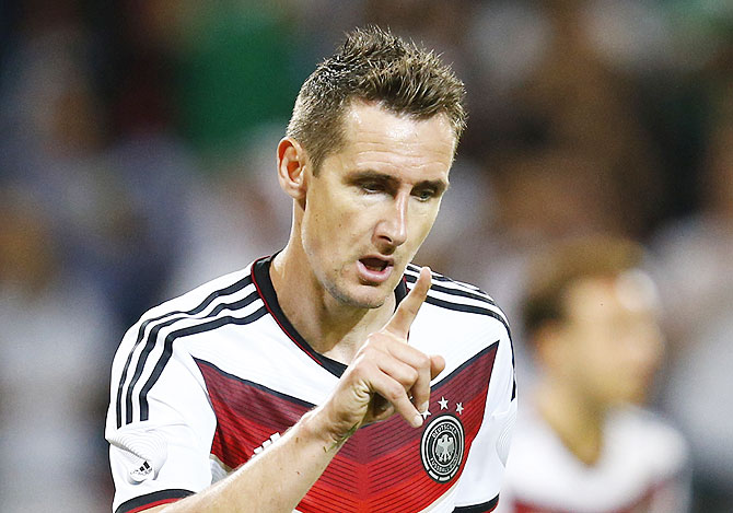 Germany's Miroslav Klose celebrates his goal during their friendly soccer match against Armenia in Mainz on Friday