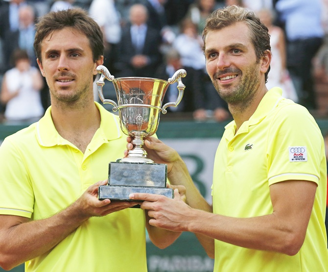 Julien Benneteau,right, and Edouard Roger-Vasselin of France pose with the trophy