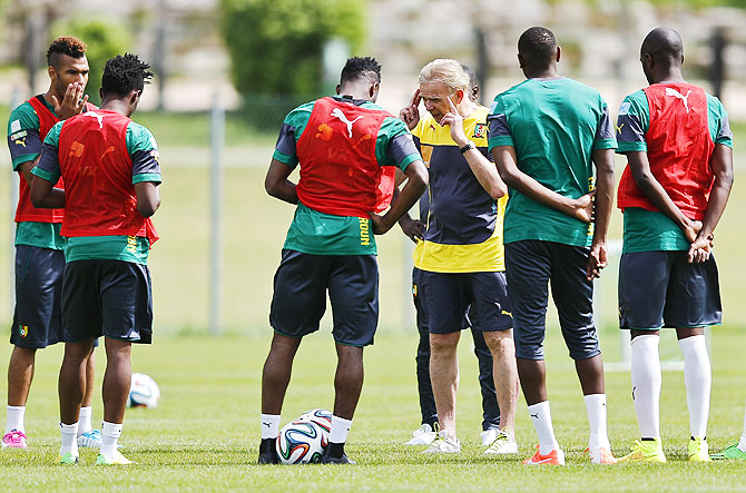 Cameroon's national soccer team coach Volker Finke (centre) talks to players during a training session
