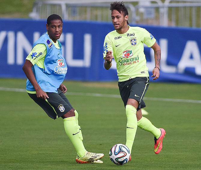 Neymar (right) in action during a training session at the squad's Granja Comary training complex, on June 09, 2014 in Teresopolis, 90 km from downtown Rio de Janeiro, Brazil, on Monday