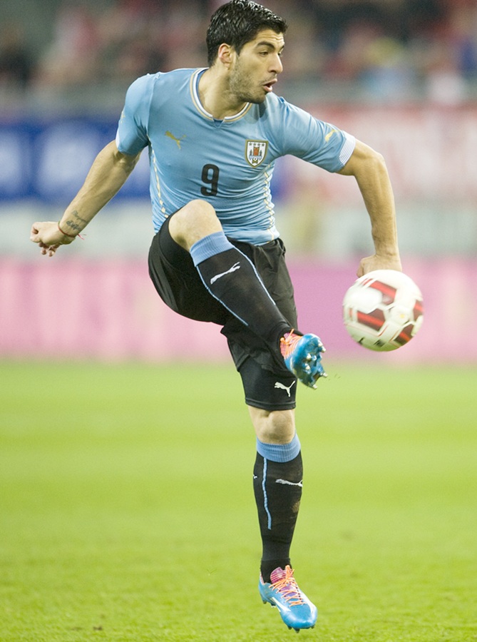 Luis Suarez of Uruguay runs with the ball