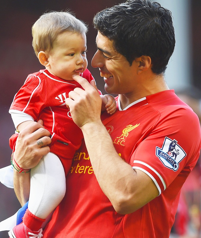 Luis Suarez of Liverpool with his son Benjamin