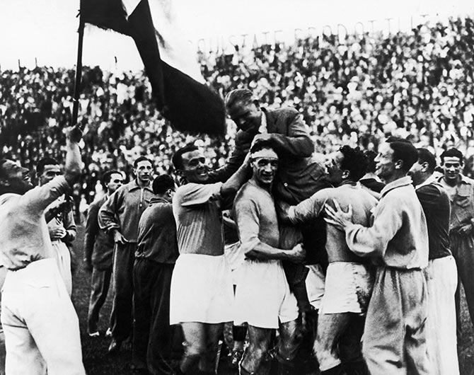 The Italian players carry their manager Vittorio Pozzo following their 2-1 victory over Czechoslovakia after extra time in the World Cup final in Rome on June 10, 1934.