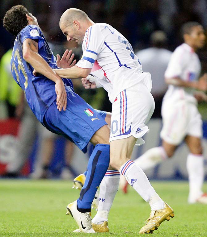 Italy's Marco Materazzi falls on the  pitch after being head-butted by France's Zinedine Zidane during the 2006 World Cup final in Berlin