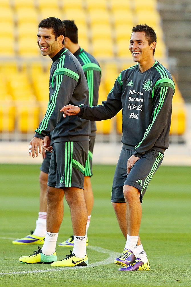 Rafael Marquez (left) and Paul Aguilar of Mexico enjoy a laugh during a team training session