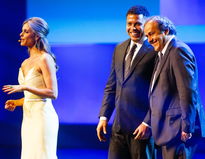 UEFA President Michel Platini,right, and Ronaldo Nazario stand onstage