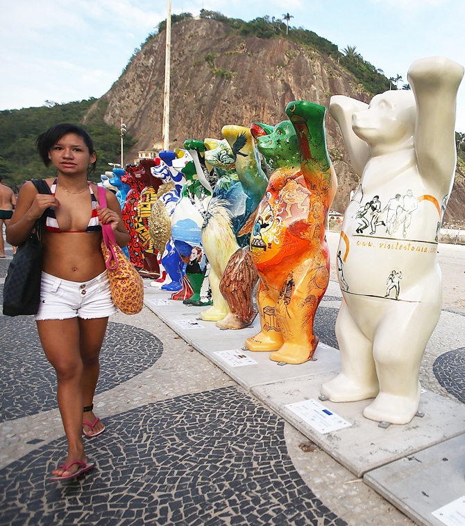 A bear statue stands amongst some of the 145 bear sculptures that form the 'United Buddy Bears' exhibition along famed Copacabana beach in Rio de Janeiro. The project promotes tolerance in the world