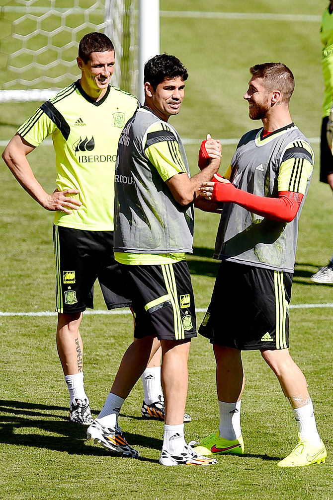 Spain players Fernando Torres, Diego Costa and Sergio Torres share a   joke during a training session at the Fedex Field in Landover, Maryland