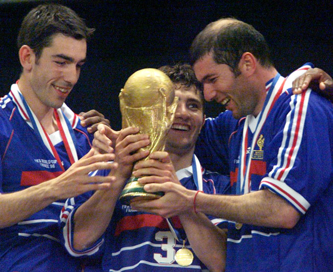 Zinedine Zidane (right) celebrates with his France team mates after winning the 1998 World Cup final in Paris, on July 12, 1998.