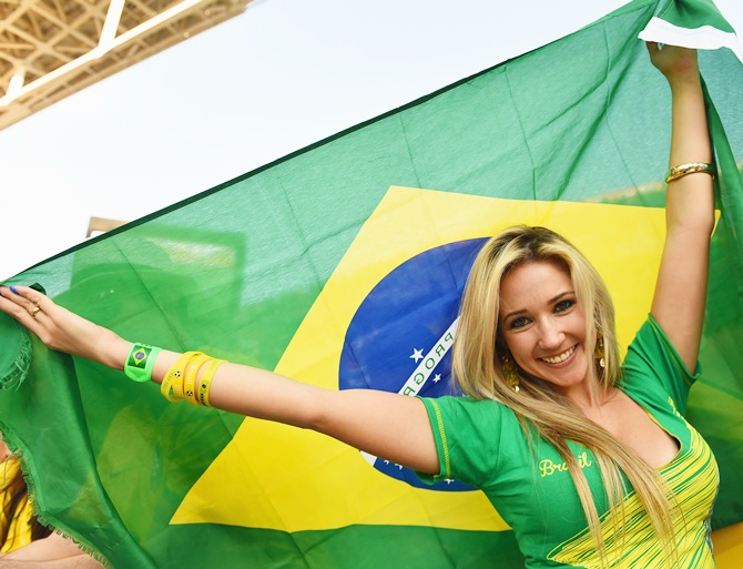 A fan waves a Brazilian flag