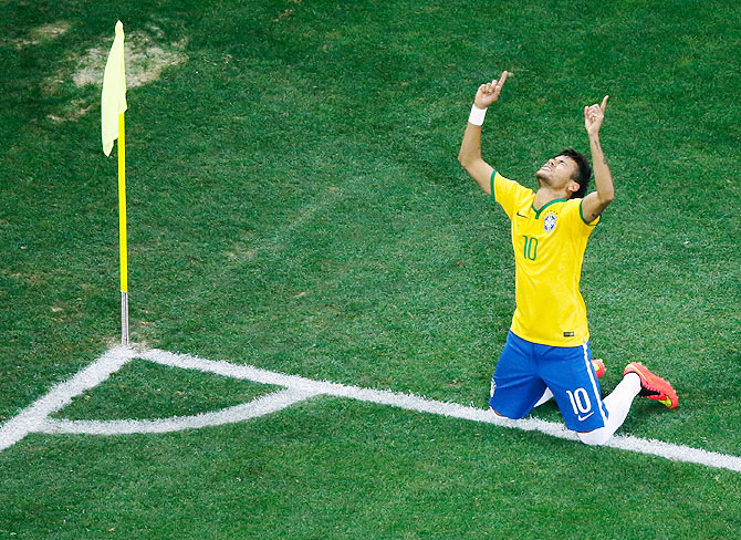 Neymar of Brazil celebrates scoring his second goal against Croatia at Arena de Sao Paulo in Sao Paulo on Thursday