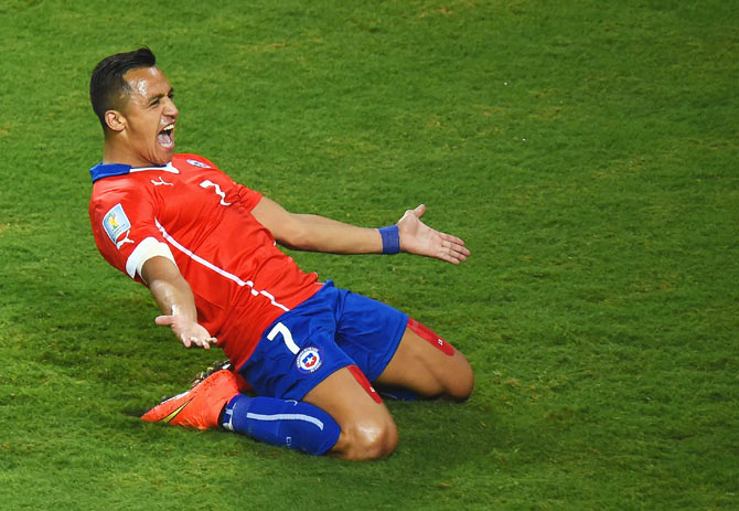 Alexis Sanchez of Chile celebrates after scoring his team's first goal against Australia at Arena Pantanal in Cuiaba, Brazil on Friday