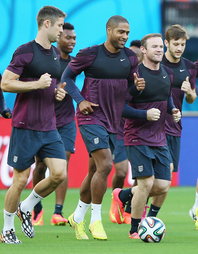 Gary Cahill, Glen Johnson and Wayne Rooney warm up during the England training session in Manaus, on Friday, ahead of their first match against Italy