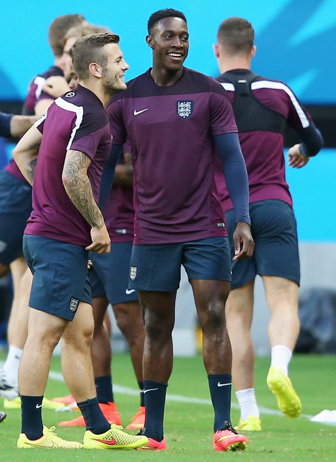 Jack Wilshire and Danny Welbeck (right) in discussion during their training session on Friday