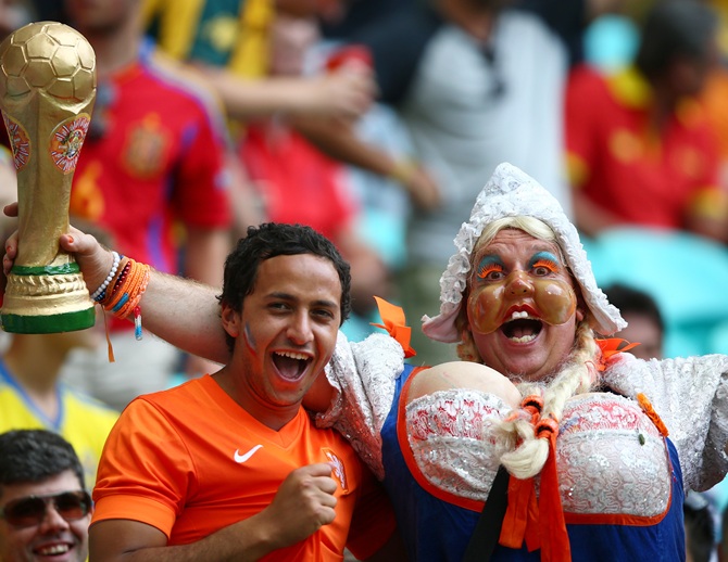 Fans watch the football game featuring Spain vs Netherland on the giant screen