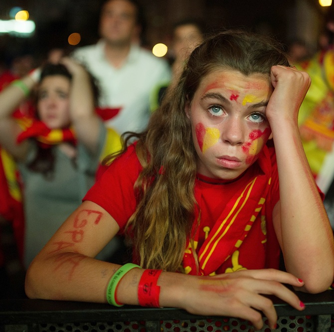 A Spanish soccer fans watches