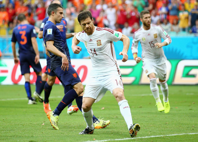 Xabi Alonso of Spain celebrates after scoring from a penalty kick