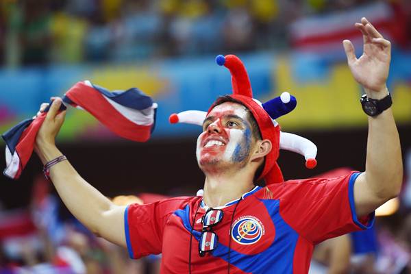 A Costa Rica fan celebrates the unexpected victory