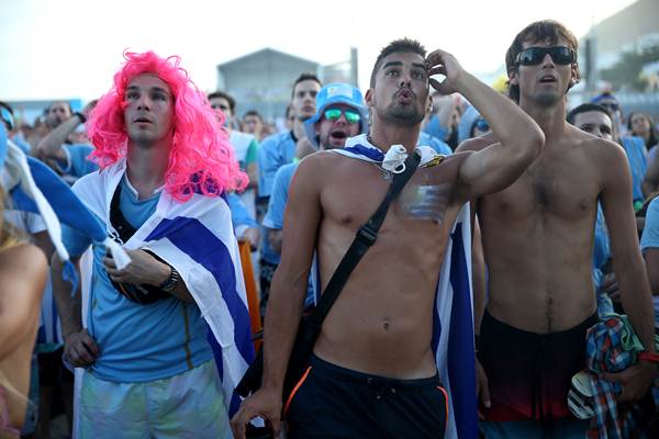 Uruguay fans react after their team concedes the third goal against Costa Rica