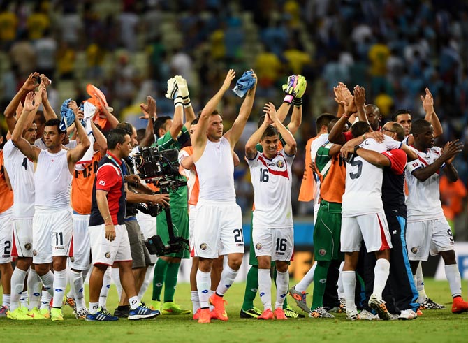 Costa Rica's players celebrate after their victory against Uruguay
