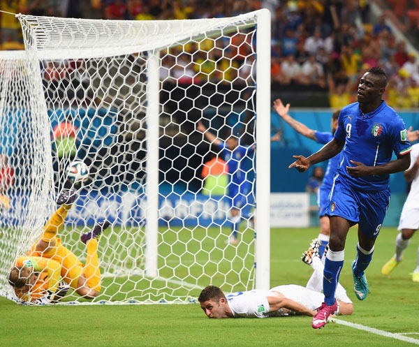 Mario Balotelli of Italy celebrates after scoring his team's second goal against England