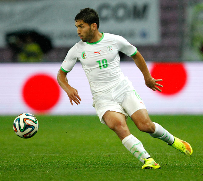 Algeria's Abdelmoumene Djabou controls the ball 