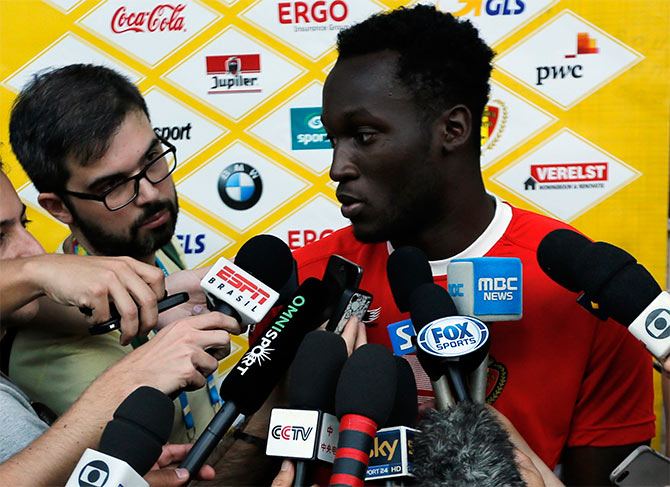 Belgium's national team player Romelu Lukaku talks to reporters before a training session