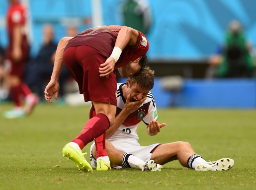 Pepe of Portugal headbutts Thomas Mueller of Germany, resulting in a red card