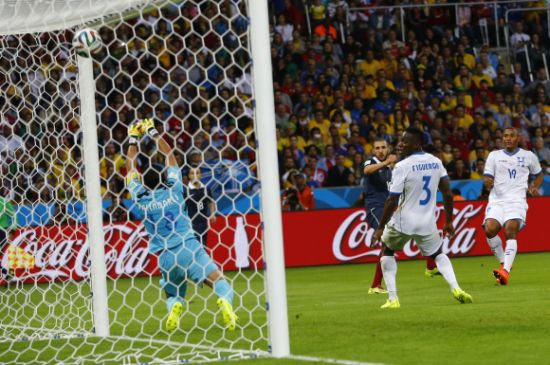 France's Karim Benzema scores past goalkeeper Noel Valladares of Honduras