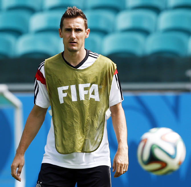 Germany's Miroslav Klose watches the ball during a training session at the Arena Fonte Nova stadium on Sunday