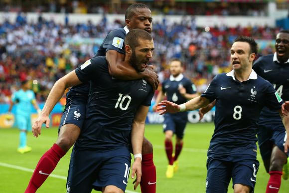 Karim Benzema of France celebrates scoring the first goal with Patrice Evra, Mathieu Valbuena against Honduras
