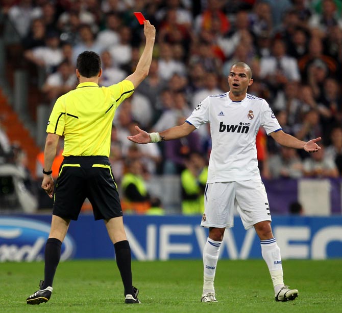 Pepe of Real Madrid is sent off by referee Wolfgang Stark during the UEFA Champions League Semi Final first leg match between Real Madrid and Barcelona in Bernabeu on April 27, 2011.