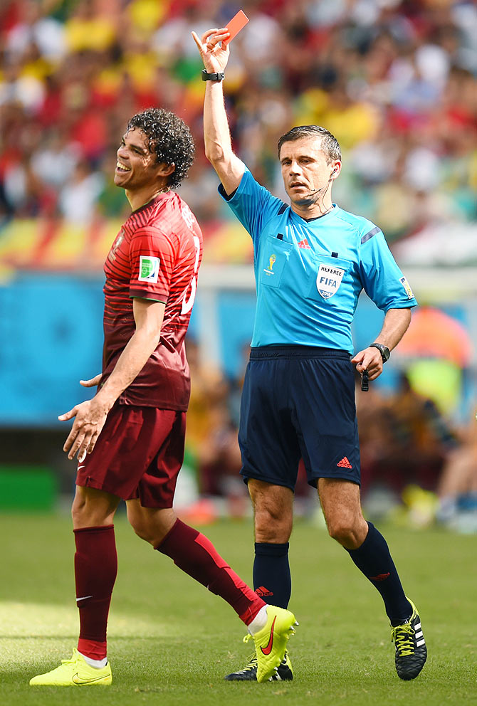 Pepe of Portugal is shown a red card and sent off by referee Milorad Mazic 