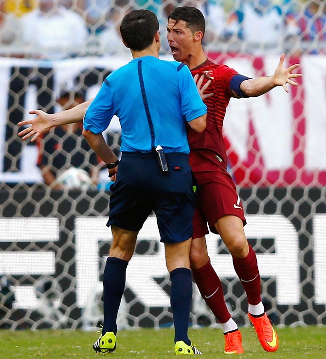 Cristiano Ronaldo of Portugal argues with referee Milorad Mazic