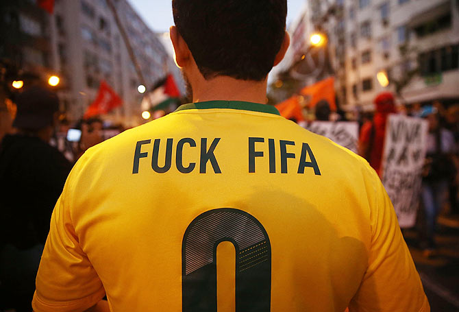 Anti-World Cup protestors gather while attempting to march to Maracana stadium on Sunday