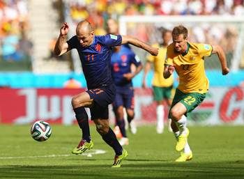 Arjen Robben of the Netherlands controls the ball on his way to scoring his team's first goal against Australia in the Group B match.