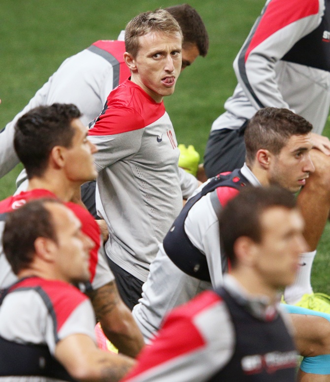 Luka Modric, centre, of Croatia looks on with his teammates during a Croatia training session