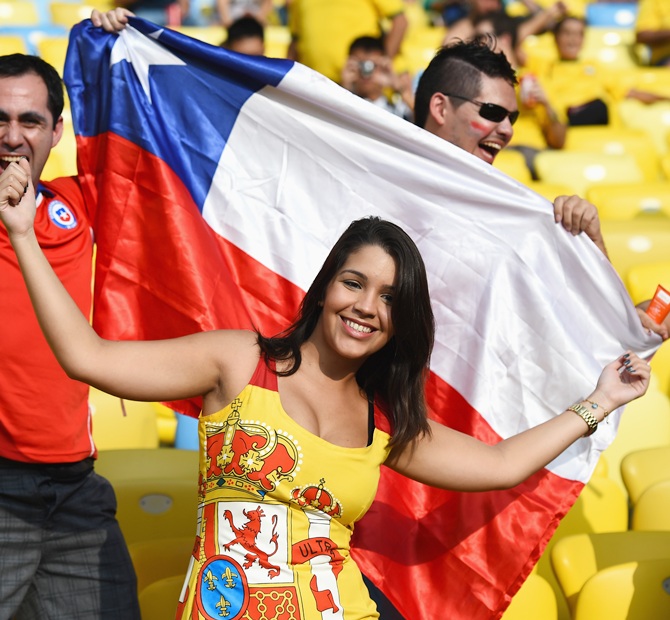 Chile and Spain fans cheer prior to the 2014 FIFA World Cup Brazil Group B match between Spain and Chile at Maracana