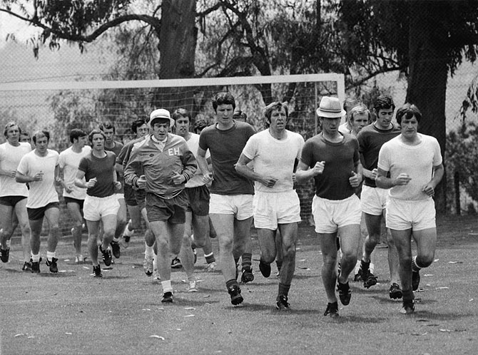 The England World Cup football team in training, Mexico City, May 1970. Wearing hats are players Emlyn Hughes (left) and Bobby Charlton
