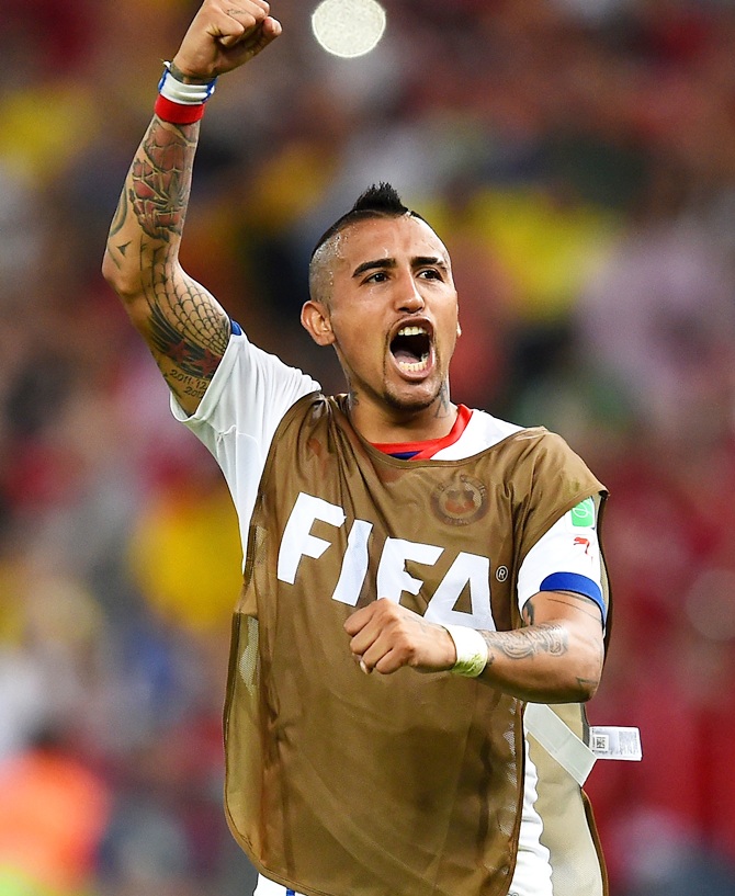 Arturo Vidal of Chile celebrates after defeating Spain 2-0
